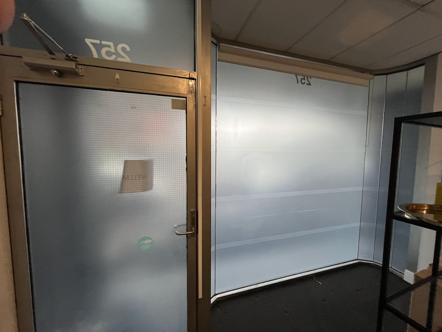 Interior glass covered in frosting film — before